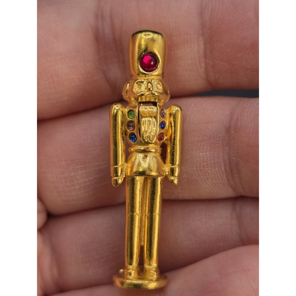 gold-toned‎ nutcracker necklace or brooch with multi-colored crystal...
